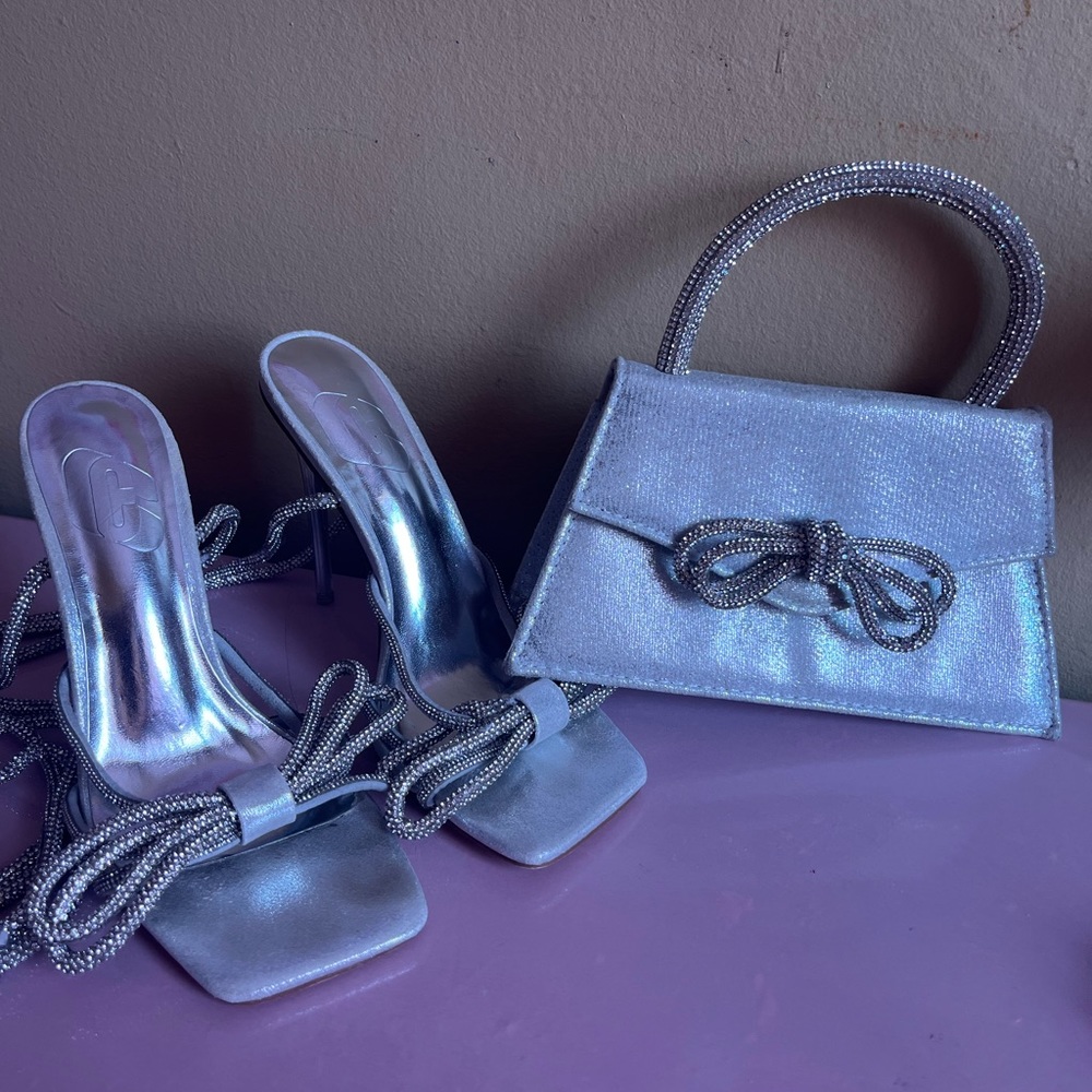 Bundle: silver heels and clutch with bow in the front.
